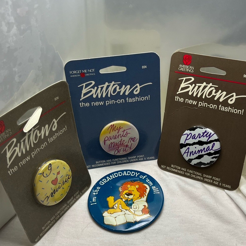 1980’s Buttons / Badges / Pins 4 different Buttons New in Packaging